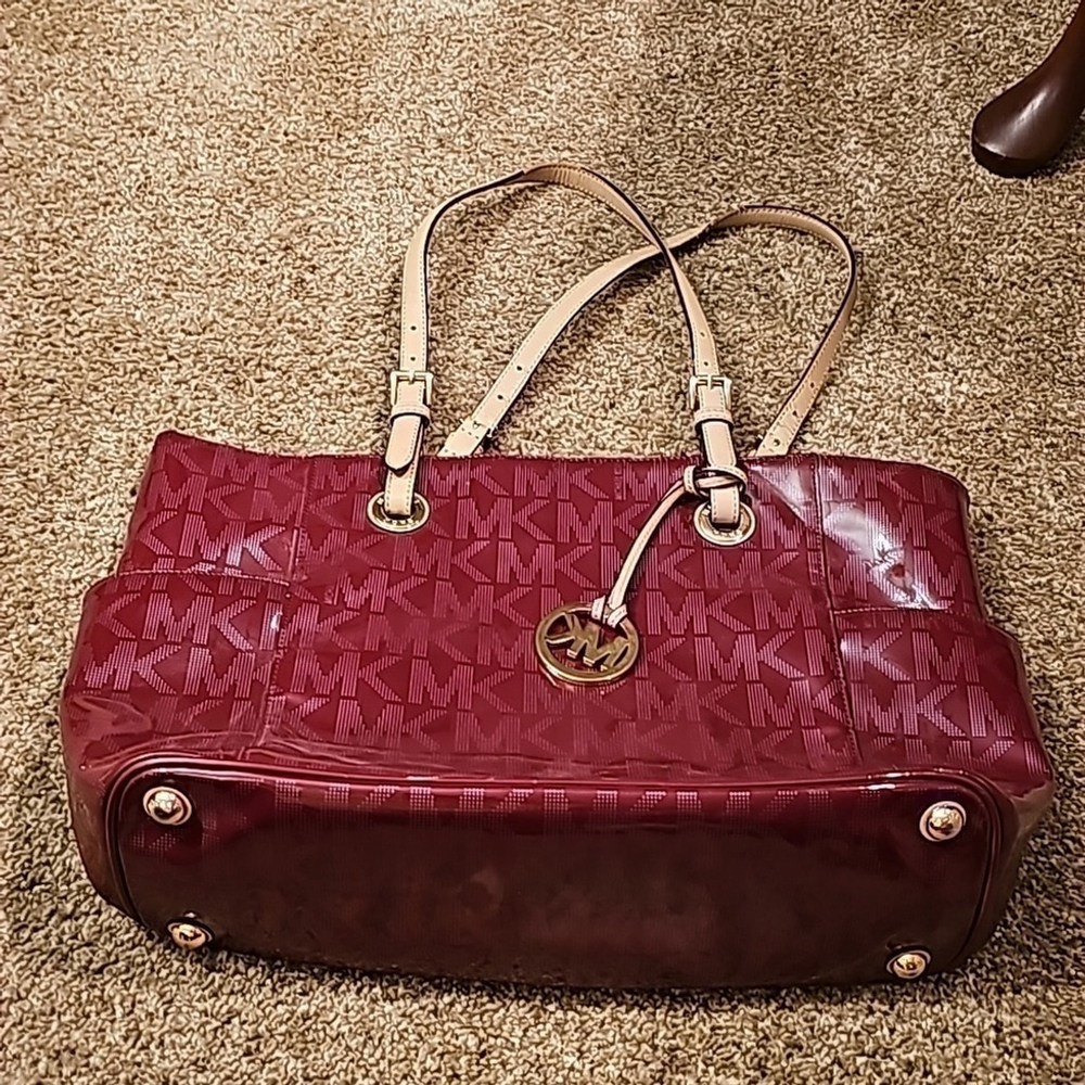 Red michael kors tote purse.